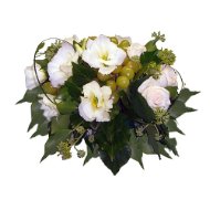 Foto Composizione centrotavola tonda con fiori e frutta.